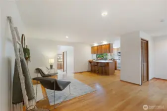 Conversation area adjcent to kitchen with second gas fireplace.