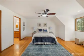 Primary bedroom with walk-in closet and adjacent bathroom on-suite.