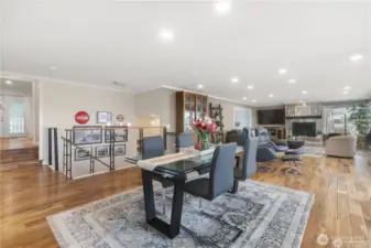 An open concept living space offers warmth, spaciousness, and seamless flow-a perfect blend of comfort and contemporary design. At the heart of the space is a beautiful gas fireplace serving as both a visual focal point and a cozy gathering spot.