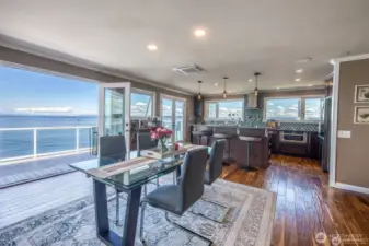 As you sit at the dining room table, enjoying a quiet breakfast, or perhaps hosting a candlelit dinner, the view out to the water is ever-present, expansive, and quietly captivating.