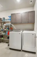 large extended laundry room with storage to the left