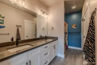 Primary bath with double sinks and walk-in shower