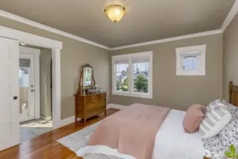 Main floor master bedroom includes dual walk in closets.