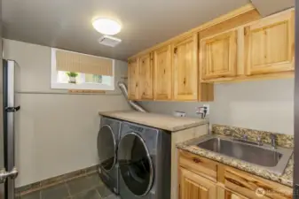 Large multipurpose room includes laundry and a kitchenette!