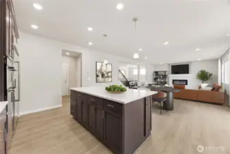 Kitchen opens to informal dining and great room - virtually staged.  Showing a similar floorplan.