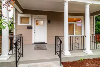 Soak in this amazing front porch! Recently coated columns, trim and concrete ensures further use for years to come!