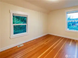 Bedroom 2 - offers (2) vinyl windows, classic doug fir flooring, fresh paint, newer craftsman style trim and its own closet!