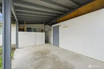 Carport off alley. Locking storage area.