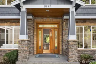 Stone, wood, and natural light come together to create a welcoming Northwest entrance.