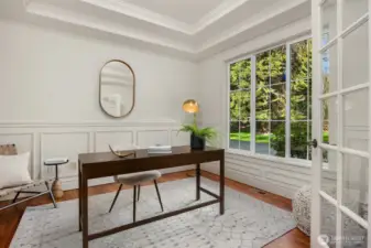 Private office with large window, detailed millwork, and natural light and ideal for work-from-home flexibility.