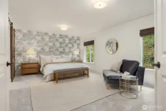 Inviting primary suite designed for comfort, featuring expansive layout and tranquil atmosphere.