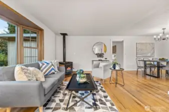 Another view of the spacious living room highlighting natural light and open flow.