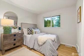 Bedroom #3 — comfortable and inviting with natural light.