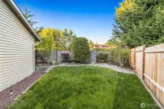 Side yard offering extra play space, pets, or gardening potential.