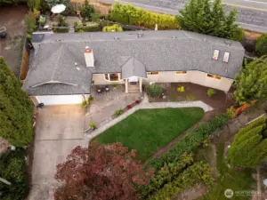 Aerial perspective highlighting the full property and peaceful setting.