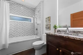 Guest Bathroom with custom tile and lighted mirror