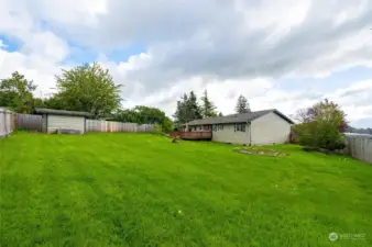 Large fully fenced back yard with shed.