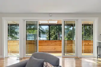 French doors to covered deck with more lake views