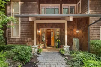 The exterior of this great home is wrapped in Western Red Cedar shingle siding and offers a Standing seam metal roof.