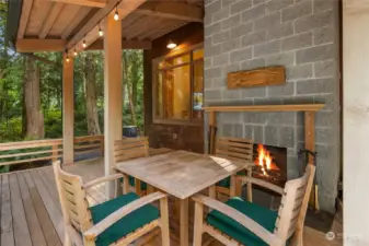 Outdoor wood-burning fireplace.  The expansive deck is crafted of durable Alaskan Yellow Cedar.