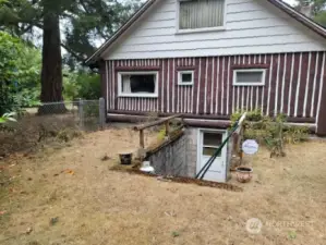 Exterior access to the basement/root cellar.  Also access inside house.