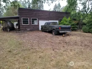 2 car garage and shop spaces.  2 carports, also.