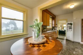 Breakfast nook open to large kitchen w/ built-ins