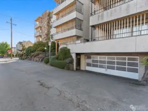 Secure parking garage with 1 parking space and a storage closet.