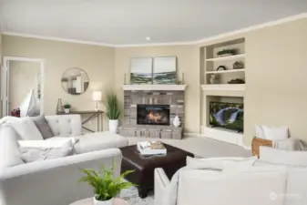 Cozy family room warmed by a stone clad fireplace and NEW carpeting.