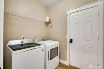 Conveniently situated between the garage and kitchen, the mudroom laundry room is a multi-functional hub. With ample storage space, it’s designed to handle daily chores and keep your home effortlessly organized. The newer washer and dryer stay with this move in ready home.