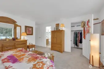 Primary bedroom with ensuite bath and walk-in closet.