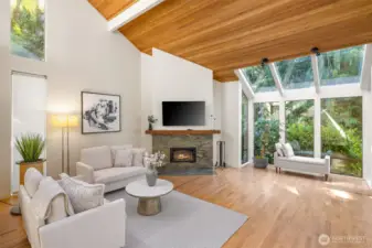 Formal living area with wood burning fireplace.