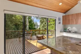 Step out on the deck from the kitchen and dining room to enjoy this lake view.