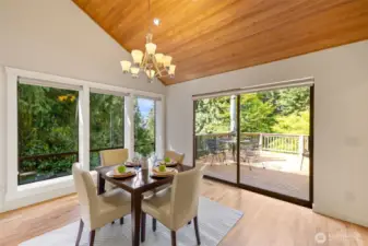 Sunny formal dining with Lake WA views. Second door to the deck.