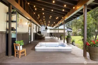 The sunken hot tub on the covered deck adds the perfect touch—ideal for unwinding in comfort, rain or shine!