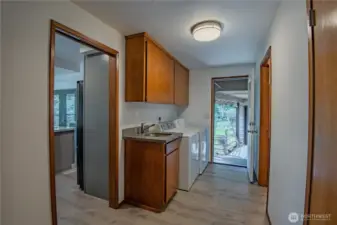 Opposite the kitchen - is the full bath that jack n jills to one of the main level bedrooms
