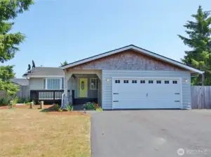 Front of this nicely renovated home with a peaceful setting at the Beach.