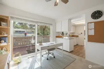Virtually staged home office with extra wide deck off the kitchen
