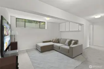 Virtually staged media room on lower level.