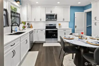 Kitchen viewing from the back door and laundry room.