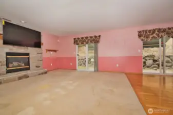 Large Living room w/ gas fireplace. Double set of sliders leading to back patio