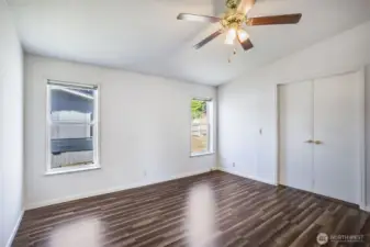 The primary bedroom is located on the opposite side of the other rooms, affording privacy and quiet.