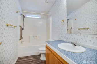 The second bathroom is located near the other two bedrooms.