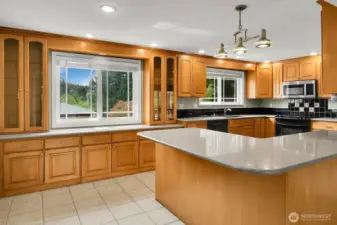Now this is a kitchen. Built in pantry, breakfast bar and eating space for informal dining.