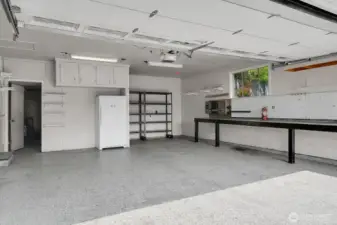 Awesome 2+ car garage with workshop bench and storage.