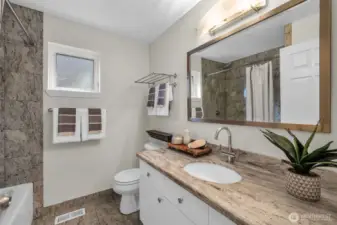 Hall bathroom with quartz counters