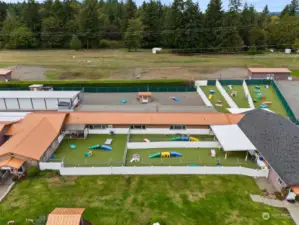 Outdoor dog play yards with k9 grass Astroturf, as well as sand play yards.