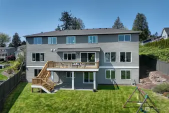 Back of house with large deck.  Beautiful view of the Cascade mountains from inside the home or from the deck.