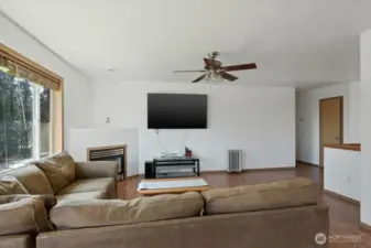 Living room, offers fireplace, open floor concept