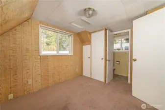 Upstairs bedroom with half bath